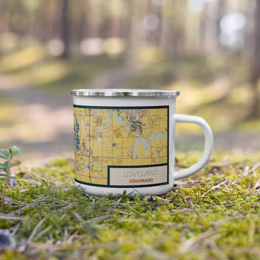 Right View Custom Loveland Colorado Map Enamel Mug in Woodblock on Grass With Trees in Background