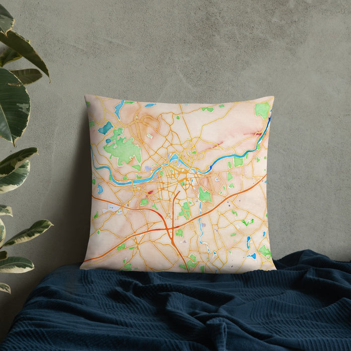 Custom Lowell Massachusetts Map Throw Pillow in Watercolor on Bedding Against Wall