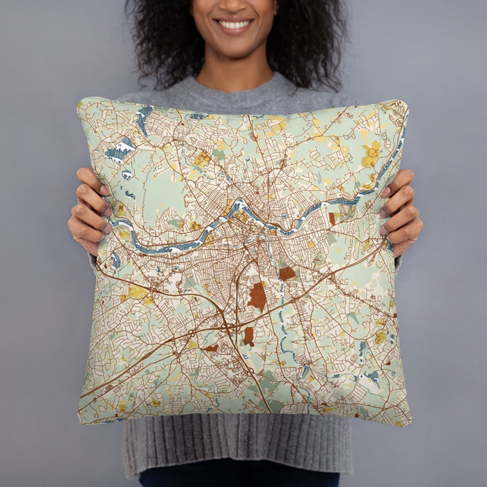 Person holding 18x18 Custom Lowell Massachusetts Map Throw Pillow in Woodblock