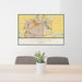 24x36 Lubbock Texas Map Print Landscape Orientation in Woodblock Style Behind 2 Chairs Table and Potted Plant
