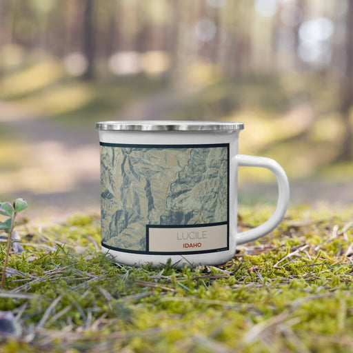 Right View Custom Lucile Idaho Map Enamel Mug in Woodblock on Grass With Trees in Background