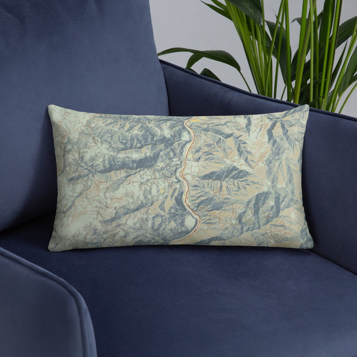Custom Lucile Idaho Map Throw Pillow in Woodblock on Blue Colored Chair