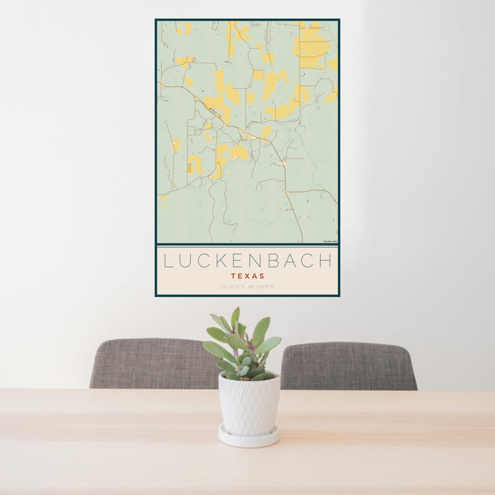 24x36 Luckenbach Texas Map Print Portrait Orientation in Woodblock Style Behind 2 Chairs Table and Potted Plant
