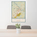 24x36 Lynchburg Virginia Map Print Portrait Orientation in Woodblock Style Behind 2 Chairs Table and Potted Plant