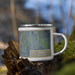 Right View Custom Lyons Colorado Map Enamel Mug in Afternoon on Grass With Trees in Background