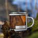 Right View Custom Lyons Colorado Map Enamel Mug in Ember on Grass With Trees in Background