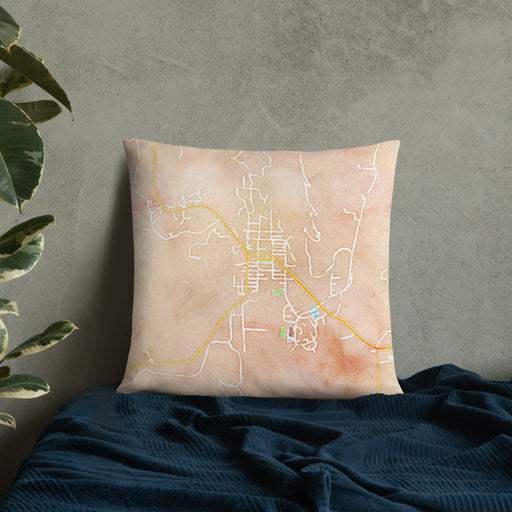 Custom Lyons Colorado Map Throw Pillow in Watercolor on Bedding Against Wall
