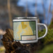 Right View Custom Lyons Colorado Map Enamel Mug in Woodblock on Grass With Trees in Background