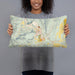 Person holding 20x12 Custom Lyons Colorado Map Throw Pillow in Woodblock