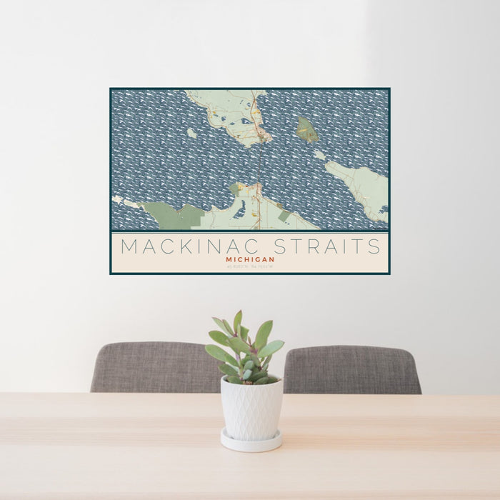 24x36 Mackinac Straits Michigan Map Print Lanscape Orientation in Woodblock Style Behind 2 Chairs Table and Potted Plant