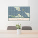 24x36 Mackinac Straits Michigan Map Print Lanscape Orientation in Woodblock Style Behind 2 Chairs Table and Potted Plant
