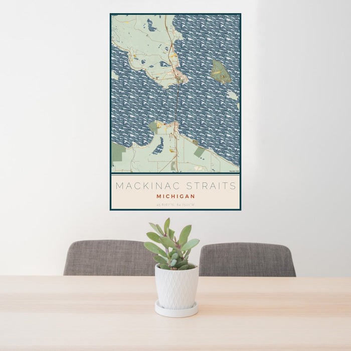 24x36 Mackinac Straits Michigan Map Print Portrait Orientation in Woodblock Style Behind 2 Chairs Table and Potted Plant