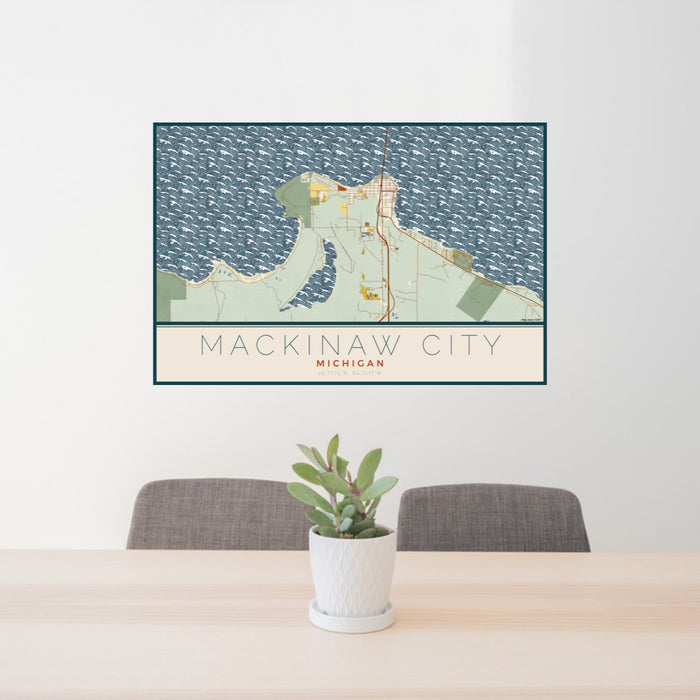 24x36 Mackinaw City Michigan Map Print Lanscape Orientation in Woodblock Style Behind 2 Chairs Table and Potted Plant