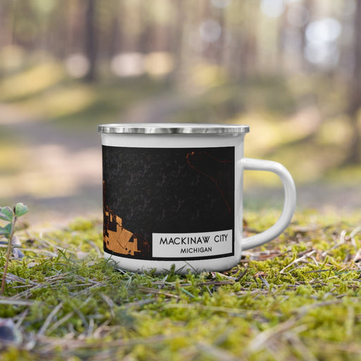 Right View Custom Mackinaw City Michigan Map Enamel Mug in Ember on Grass With Trees in Background