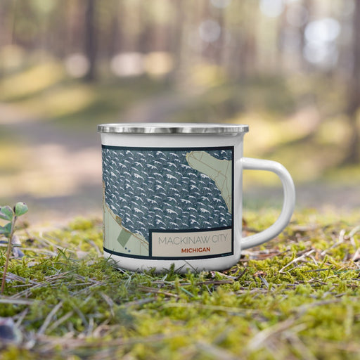 Right View Custom Mackinaw City Michigan Map Enamel Mug in Woodblock on Grass With Trees in Background