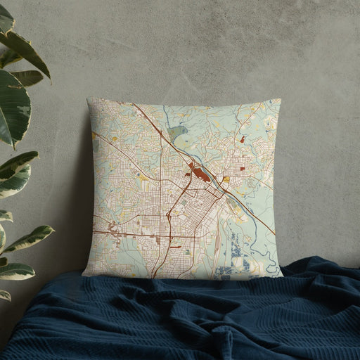 Custom Macon Georgia Map Throw Pillow in Woodblock on Bedding Against Wall