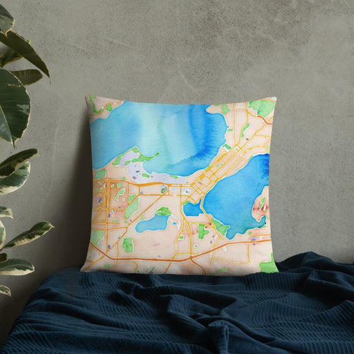 Custom Madison Wisconsin Map Throw Pillow in Watercolor on Bedding Against Wall