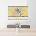 24x36 Madison Wisconsin Map Print Landscape Orientation in Woodblock Style Behind 2 Chairs Table and Potted Plant