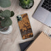 Custom Magazine Arkansas Map Phone Case in Ember on Table with Laptop and Plant