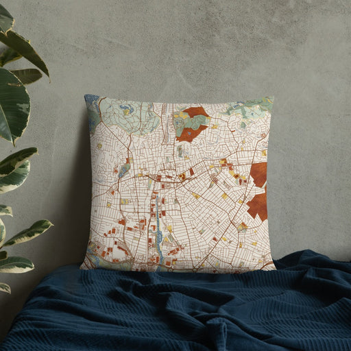 Custom Malden Massachusetts Map Throw Pillow in Woodblock on Bedding Against Wall