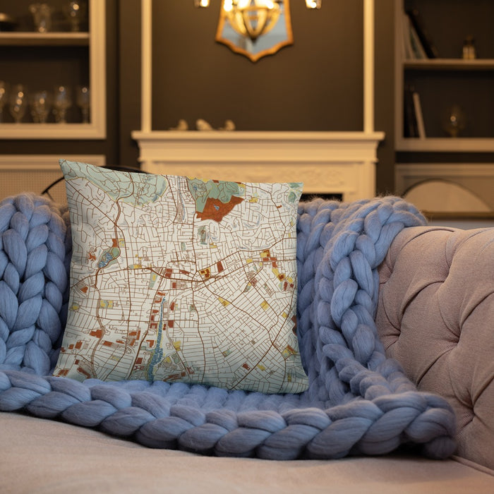 Custom Malden Massachusetts Map Throw Pillow in Woodblock on Cream Colored Couch