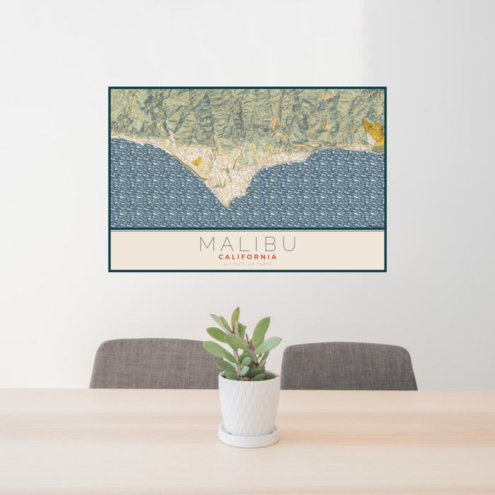 24x36 Malibu California Map Print Lanscape Orientation in Woodblock Style Behind 2 Chairs Table and Potted Plant