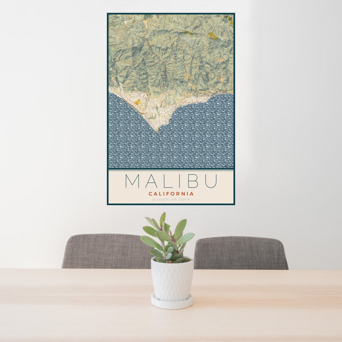 24x36 Malibu California Map Print Portrait Orientation in Woodblock Style Behind 2 Chairs Table and Potted Plant