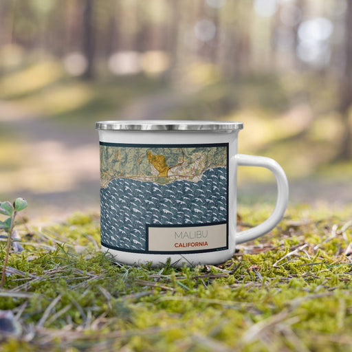 Right View Custom Malibu California Map Enamel Mug in Woodblock on Grass With Trees in Background