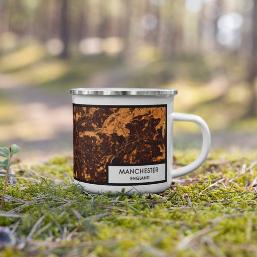 Right View Custom Manchester England Map Enamel Mug in Ember on Grass With Trees in Background