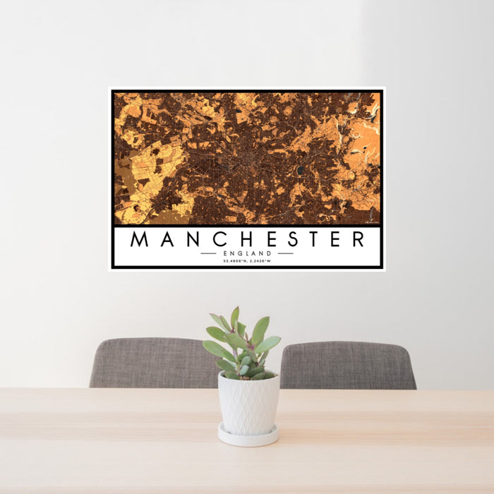 24x36 Manchester England Map Print Landscape Orientation in Ember Style Behind 2 Chairs Table and Potted Plant