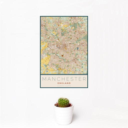 12x18 Manchester England Map Print Portrait Orientation in Woodblock Style With Small Cactus Plant in White Planter
