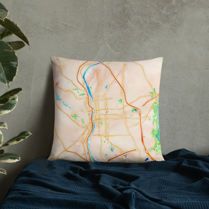 Custom Manchester New Hampshire Map Throw Pillow in Watercolor on Bedding Against Wall