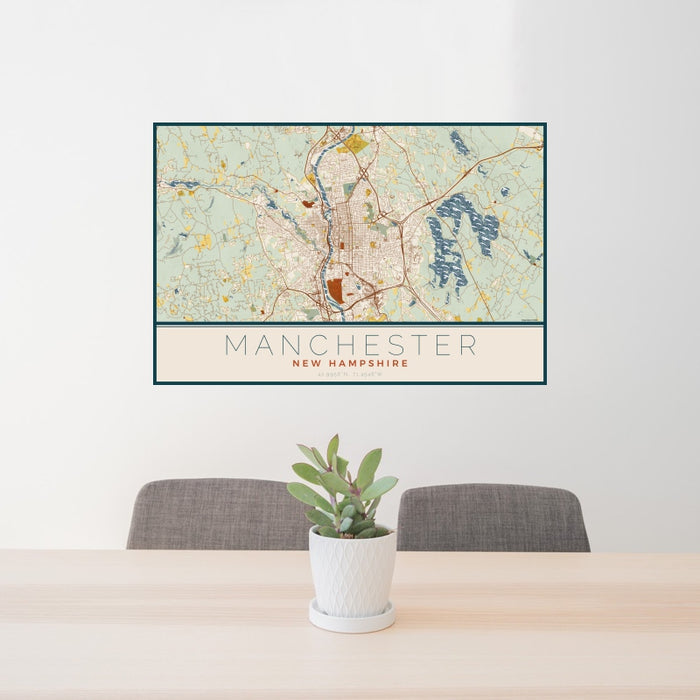 24x36 Manchester New Hampshire Map Print Landscape Orientation in Woodblock Style Behind 2 Chairs Table and Potted Plant