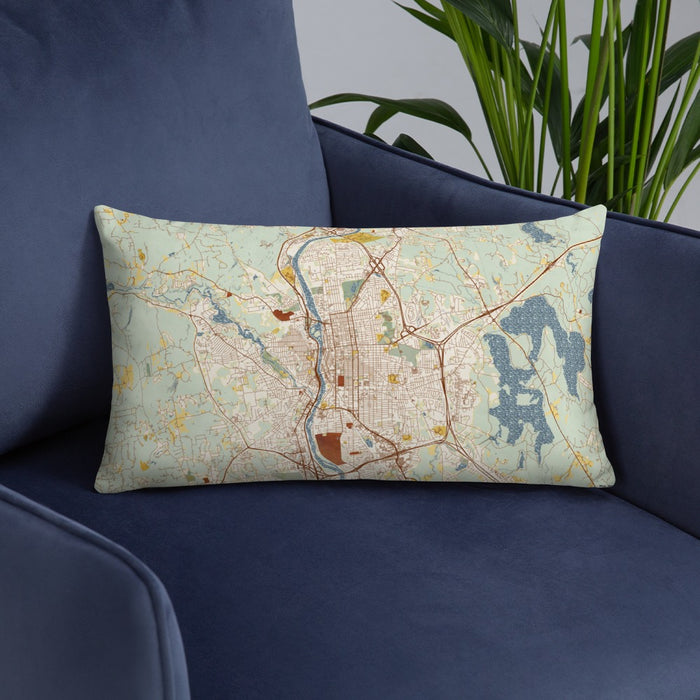 Custom Manchester New Hampshire Map Throw Pillow in Woodblock on Blue Colored Chair