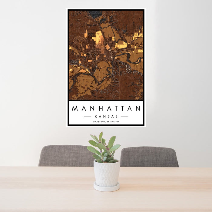 24x36 Manhattan Kansas Map Print Portrait Orientation in Ember Style Behind 2 Chairs Table and Potted Plant