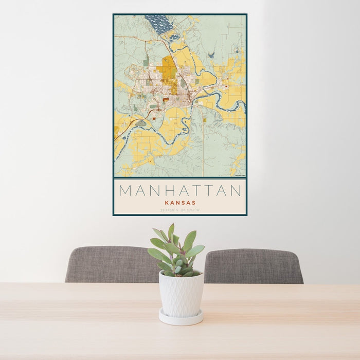 24x36 Manhattan Kansas Map Print Portrait Orientation in Woodblock Style Behind 2 Chairs Table and Potted Plant