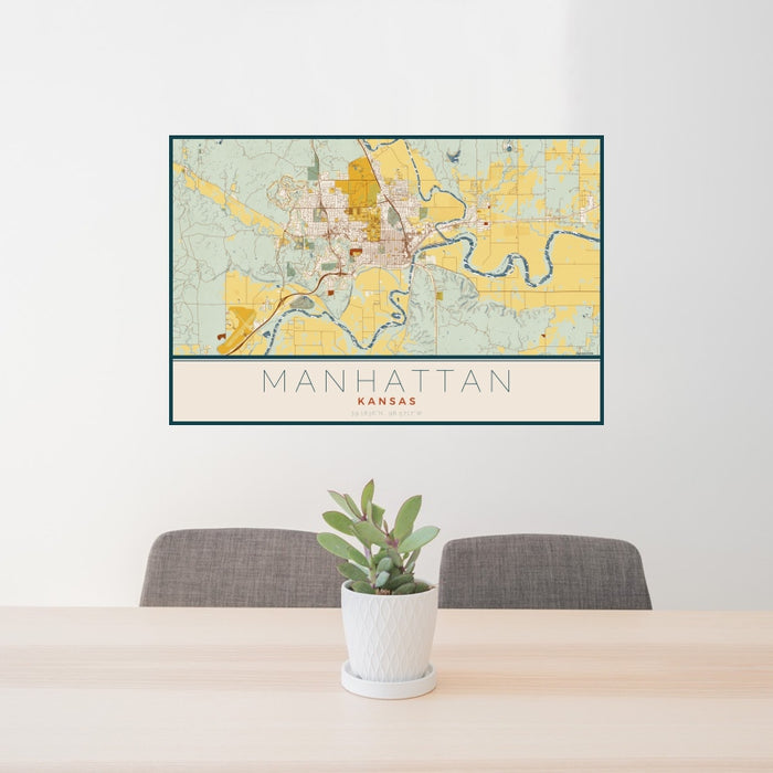24x36 Manhattan Kansas Map Print Landscape Orientation in Woodblock Style Behind 2 Chairs Table and Potted Plant