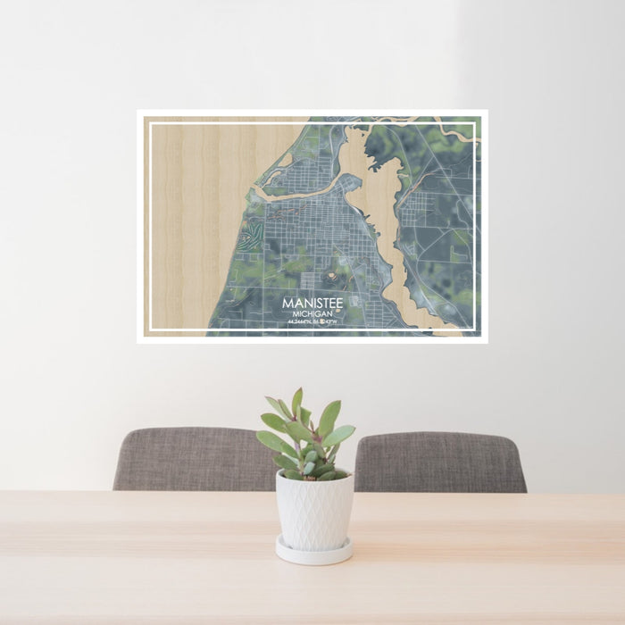 24x36 Manistee Michigan Map Print Lanscape Orientation in Afternoon Style Behind 2 Chairs Table and Potted Plant