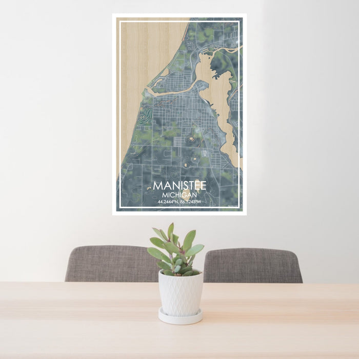24x36 Manistee Michigan Map Print Portrait Orientation in Afternoon Style Behind 2 Chairs Table and Potted Plant
