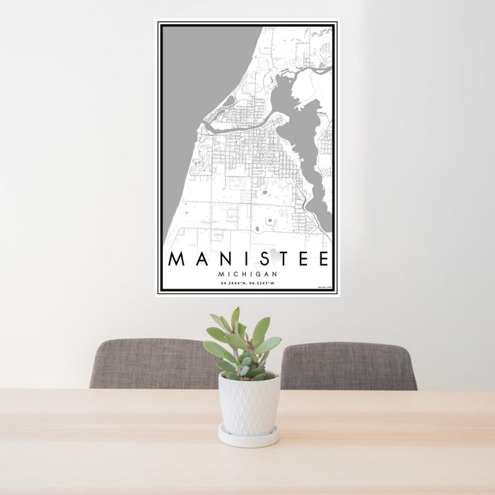 24x36 Manistee Michigan Map Print Portrait Orientation in Classic Style Behind 2 Chairs Table and Potted Plant