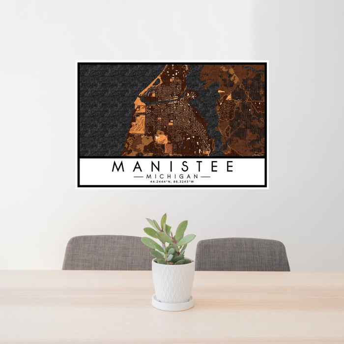 24x36 Manistee Michigan Map Print Lanscape Orientation in Ember Style Behind 2 Chairs Table and Potted Plant
