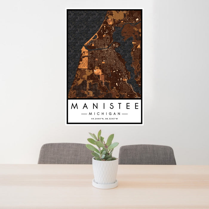 24x36 Manistee Michigan Map Print Portrait Orientation in Ember Style Behind 2 Chairs Table and Potted Plant