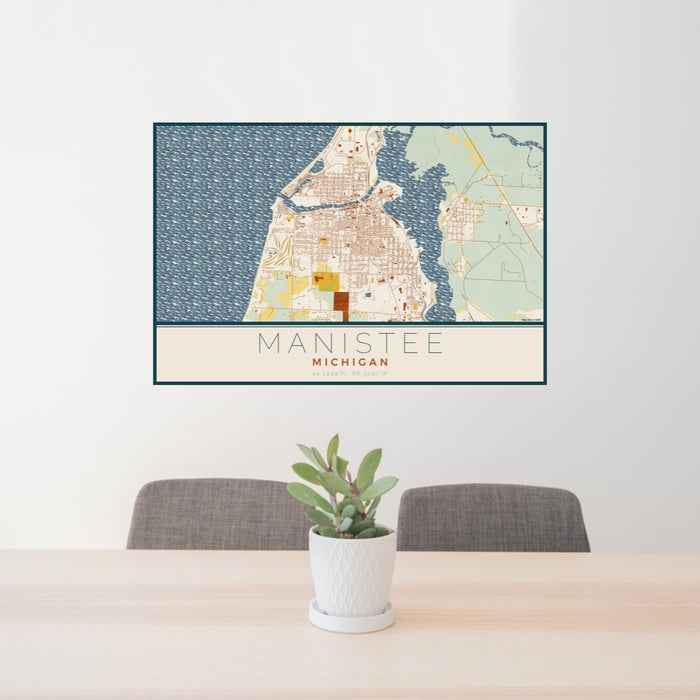 24x36 Manistee Michigan Map Print Lanscape Orientation in Woodblock Style Behind 2 Chairs Table and Potted Plant