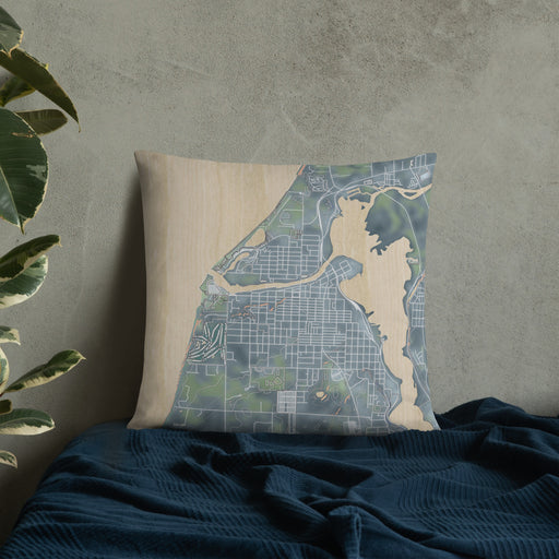 Custom Manistee Michigan Map Throw Pillow in Afternoon on Bedding Against Wall