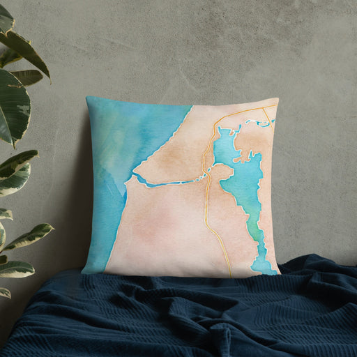 Custom Manistee Michigan Map Throw Pillow in Watercolor on Bedding Against Wall