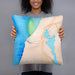 Person holding 18x18 Custom Manistee Michigan Map Throw Pillow in Watercolor