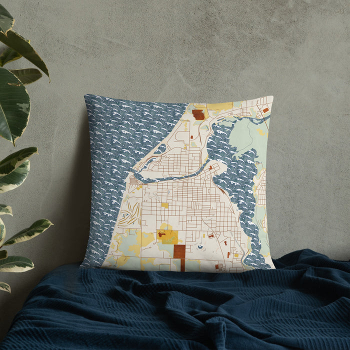 Custom Manistee Michigan Map Throw Pillow in Woodblock on Bedding Against Wall