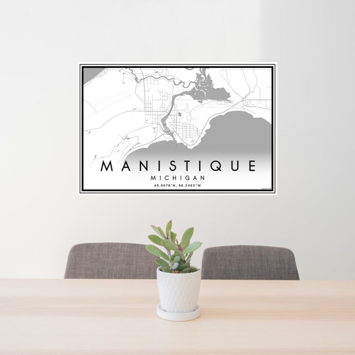 24x36 Manistique Michigan Map Print Lanscape Orientation in Classic Style Behind 2 Chairs Table and Potted Plant