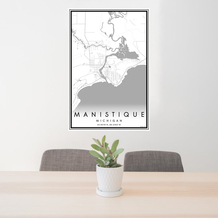 24x36 Manistique Michigan Map Print Portrait Orientation in Classic Style Behind 2 Chairs Table and Potted Plant