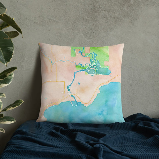 Custom Manistique Michigan Map Throw Pillow in Watercolor on Bedding Against Wall